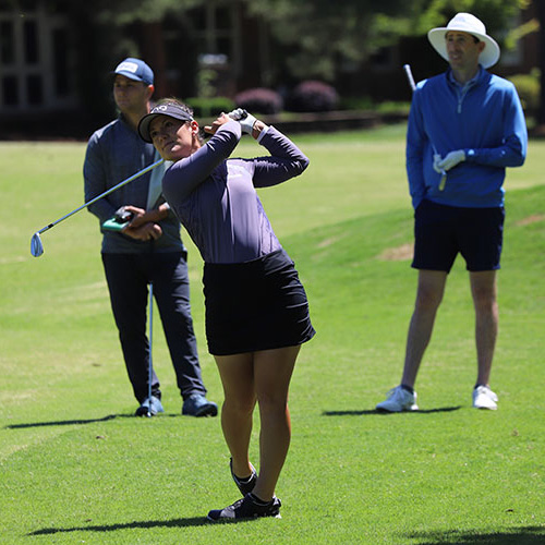 Haylee Harford and player partners on course