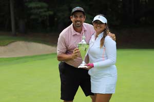Lilia Vu and caddie with trophy